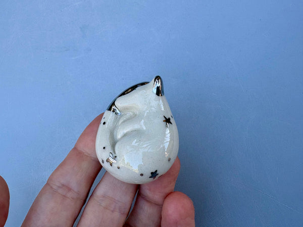 Tiny Guardian: Arctic Fox Figurine Ceramic Sculpture with Silver (22kt white gold)