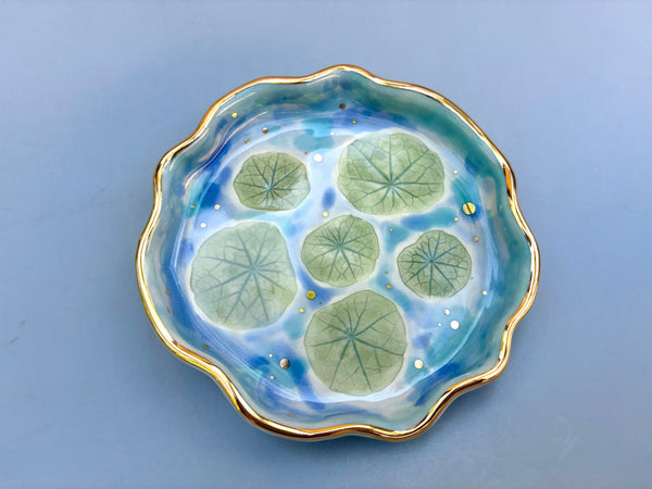 Lily pad pond (nasturtium leaves), ceramic dish with gold accents.