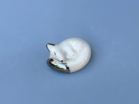 Tiny Guardian: Arctic Fox Figurine Ceramic Sculpture with Silver (22kt white gold)