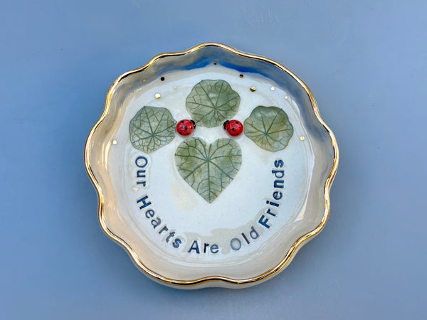 Our Hearts Are Old Friends, Ladybug with Heart Shaped Leaves, Ceramic Dish with Gold Accents - Vuvu Ceramics