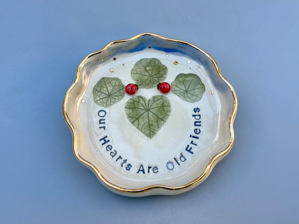 Our Hearts Are Old Friends, Ladybug with Heart Shaped Leaves, Ceramic Dish with Gold Accents - Vuvu Ceramics