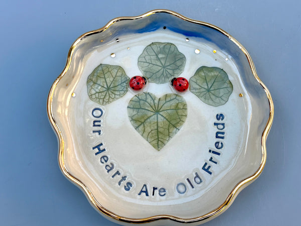 Our Hearts Are Old Friends, Ladybug with Heart Shaped Leaves, Ceramic Dish with Gold Accents - Vuvu Ceramics