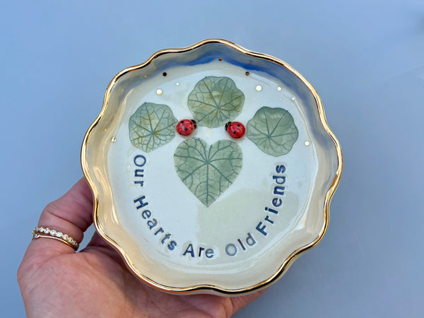 Our Hearts Are Old Friends, Ladybug with Heart Shaped Leaves, Ceramic Dish with Gold Accents - Vuvu Ceramics