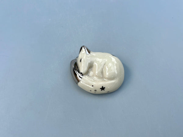 Tiny Guardian: Arctic Fox Figurine Ceramic Sculpture with Silver (22kt white gold) - Vuvu Ceramics