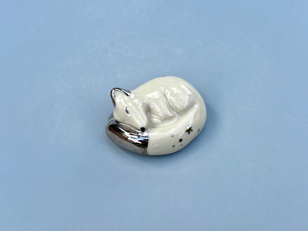 Tiny Guardian: Arctic Fox Figurine Ceramic Sculpture with Silver (22kt white gold) - Vuvu Ceramics